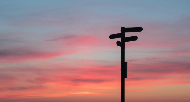 Signpost and sunset